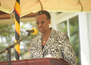 Minister Checking UCE 2022 results via SMS