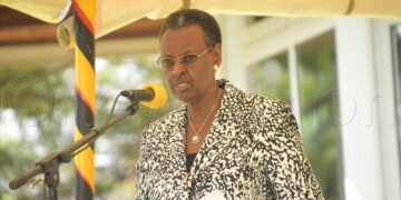 Minister Checking UCE 2022 results via SMS