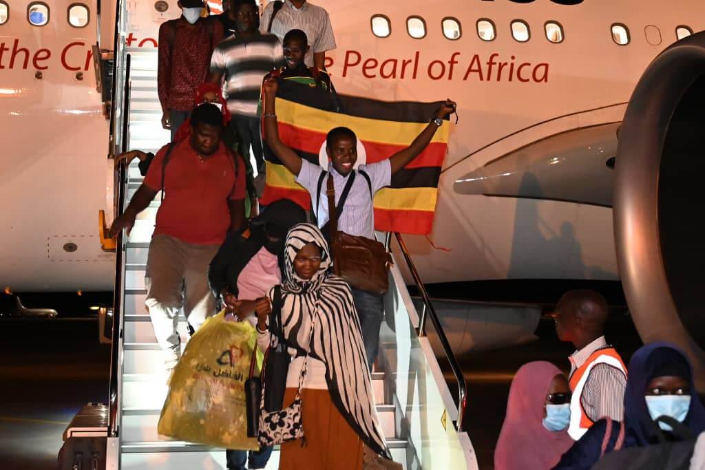 ugandans return home khartoum sudan